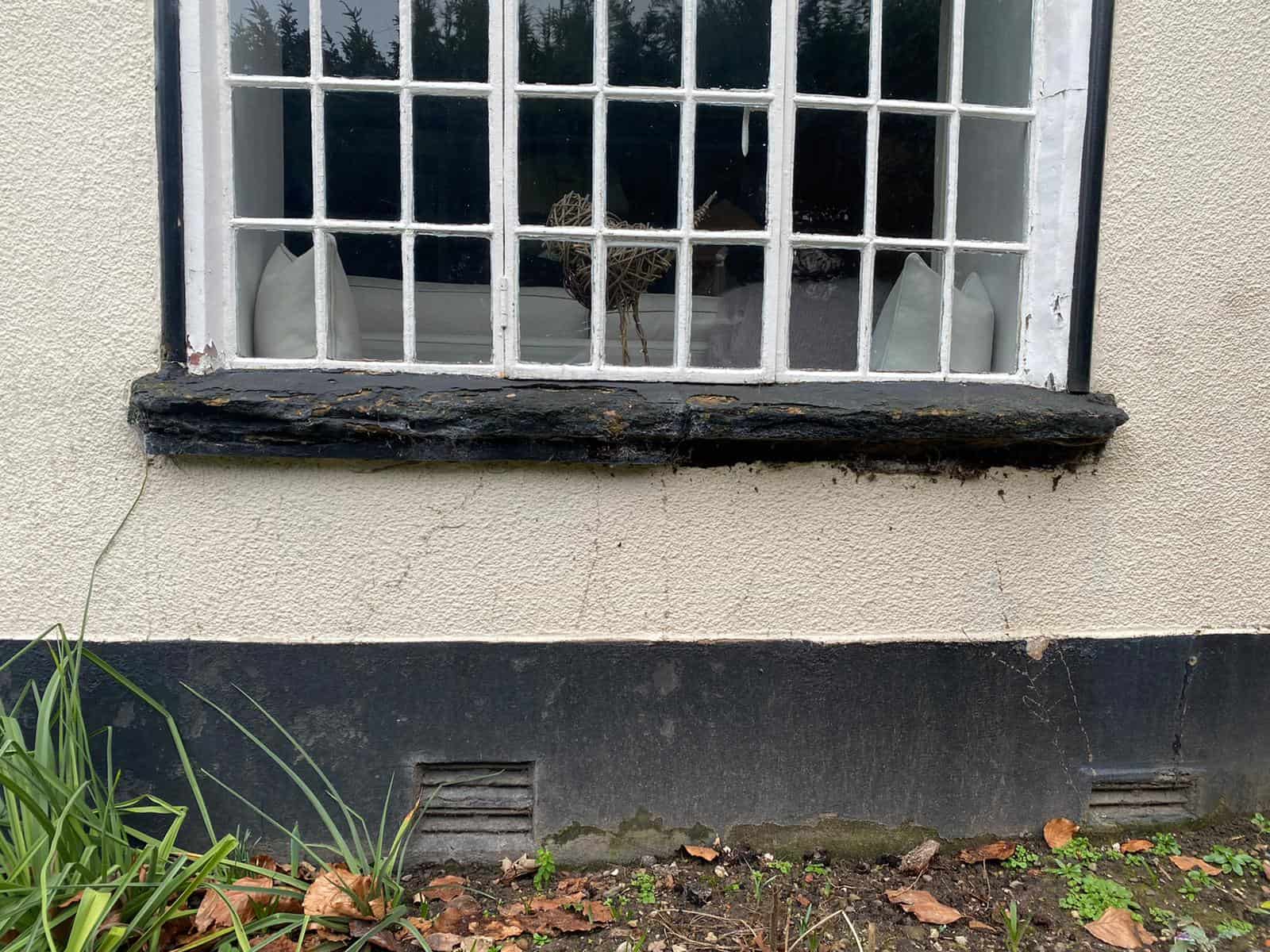 Damaged gothic window sill before repair